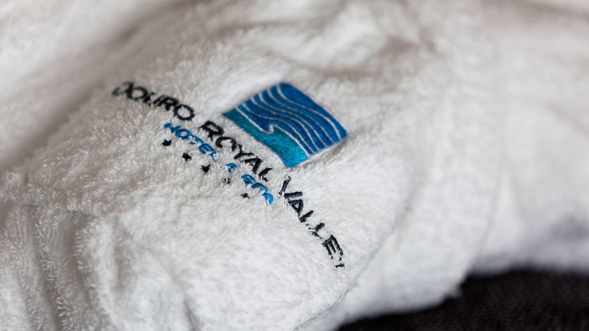 Douro Royal Valley Hotel & Spa Ribadouro Exterior photo A towel with the hotel's logo